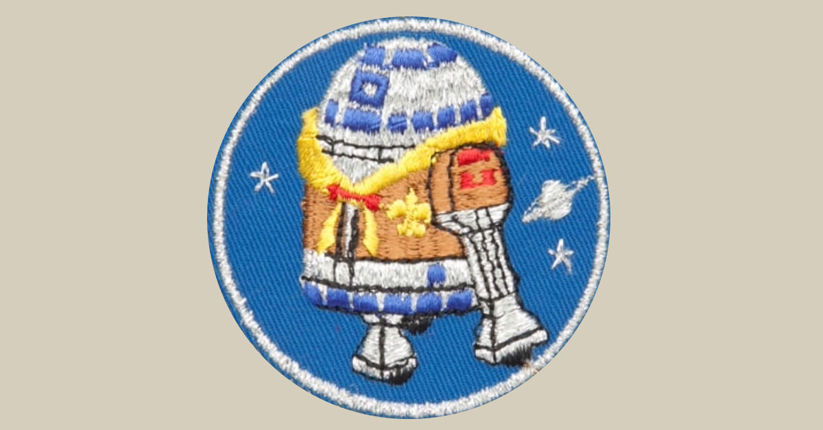 R2-D2 wearing a Scout uniform